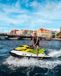 Are photos included with Curacao jetski packages?
